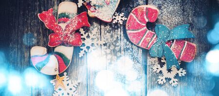 Christmas Light with Bokeh on Wooden Fir Tree Toys Candy Canes, Bell on Wooden Desk. Snowflakesの写真素材