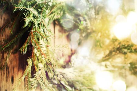 Close up of Selective Focus Natural Wreath with Christmas Light on Wooden Background, warm tonedの写真素材