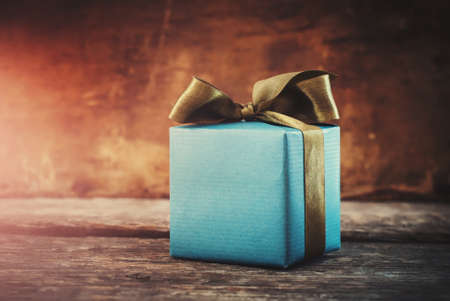 Christmas Gift. Festive Box on Wooden Background. Tonedの写真素材