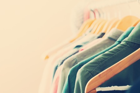 Pastel Color Clothes. Female Dresses on Open Clothes Rail. Toned imageの写真素材