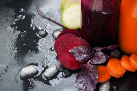 Fresh Juice Smoothie Vegetables Orange Green Violet Bottles Color Black Background Selective Focusの写真素材