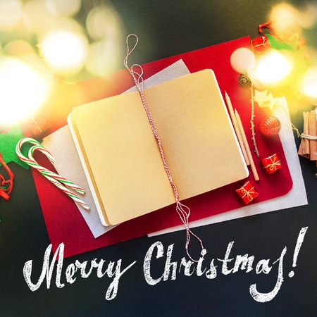 Merry Christmas Banner Letter Book Text Red White Holiday Fir Tree Toy Decor Star Ball Gift Magic Composition Dark Background Top Viewの写真素材