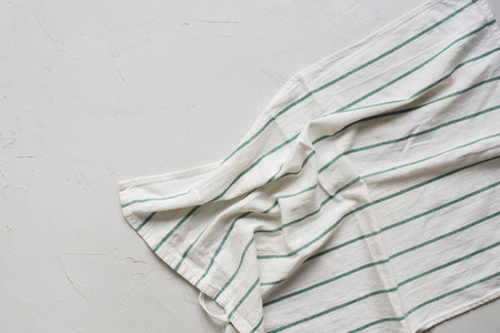 Served Table with White Crumpled Striped Napkin Top View Minimal Picture on Grey Vintage Backgroundの写真素材