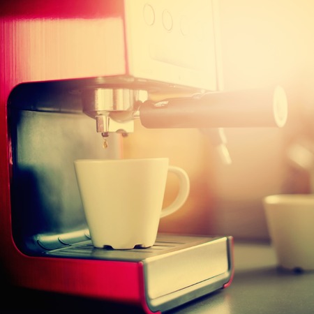 Close-up of Coffee Espresso Pouring from Machine Home Made Cooking Tonedの写真素材