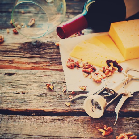 Red Wine Walnuts Cheese Opener Wooden Table Rural Style Vintage Copy Spaceの写真素材
