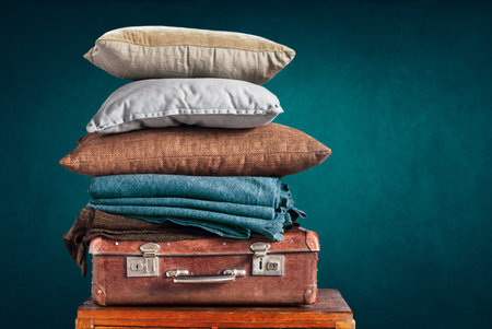 Vintage Ancient Suitcase Pillow Plaid Stack Tower Design Concept Shabby Dark Background