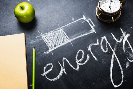 concept saving energy different methods healthy food green apple right life style alarm clock early wake up black background symbol charging batteryの写真素材