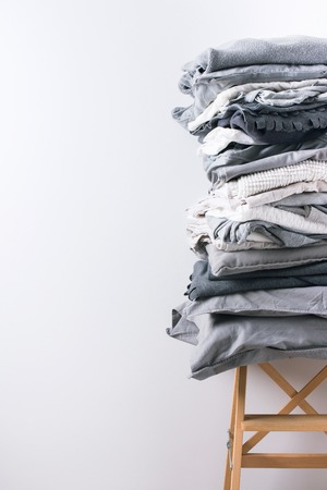 stacks monochrome gradient white gray black bed linen textiles clothing background pile conceptの写真素材