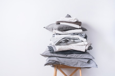 stacks monochrome gradient white gray black bed linen textiles clothing background pile conceptの写真素材