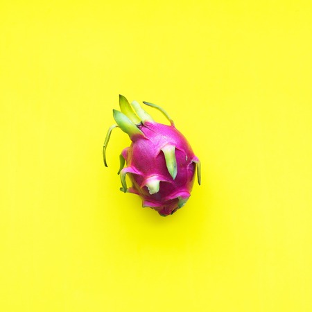 Dragon Pitahaya One Whole Tropical Fruit Yellow Background Object Useful Natural Organic Food Style Minimalism Top View Flat Layの写真素材