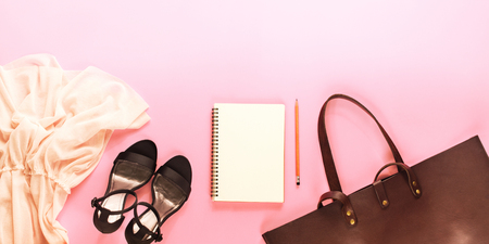 Woman Accessory Set Pink Lacy Dress Black Open Shoes Brown Luxury Leather Bag Note Book Top View Pink Background Flat Lay Copy Space Shopping Timeの写真素材