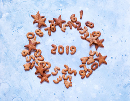 figures 2019 congratulation Merry Christmas card from gingerbread cookies.