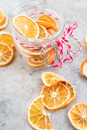 Homemade dried oranges slices in the jar from above. Christmas natural and organic decoration.の写真素材