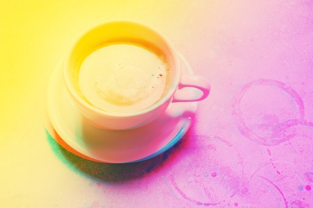 White cup fresh coffee scattered grains unhealthy food top view.の写真素材