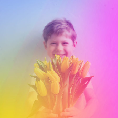 Portrait smiling boy with yellow bouquet tulips for mom Spring flowers Concept Mother's Day...