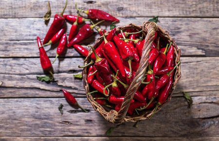 Red hot chili pepper on wooden background. Country styleの写真素材