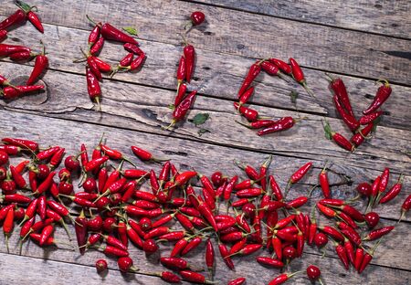 Red hot chili pepper on wooden background. Country styleの写真素材