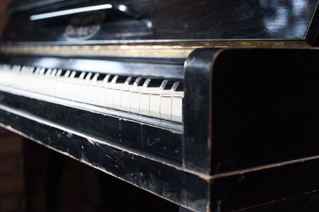 Old piano keyboard background with selective focus. Vintage retro instrumentの写真素材
