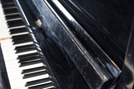 Old piano keyboard background with selective focus. Vintage retro instrumentの写真素材
