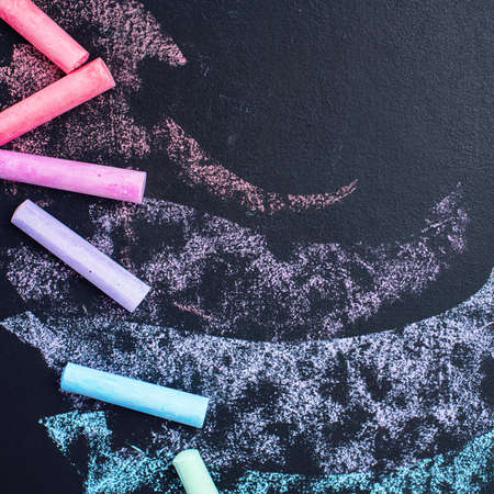 Drawn Strokes Pieces Colored Chalks on Black Texture Background School Conceptの写真素材
