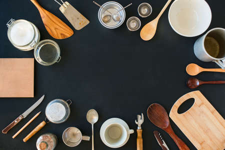 Frame Composition Kitchen Accessories Preparation Cooking Black Table Wooden Metal Dishes Ware Different Support Stuff Top View Flat Lay Copy Spaceの写真素材