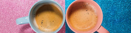 Two cups hot fresh coffee on bright pink blue brilliant paper. Food background. Top view. Flat lay. Minimalism. Bannerの写真素材