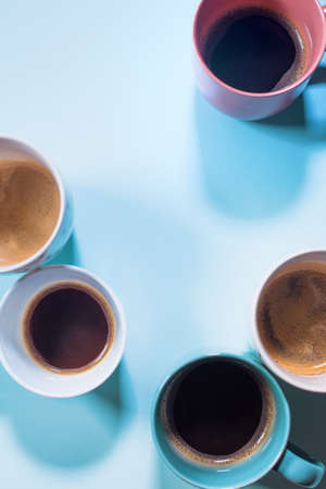 Different fresh group cups of coffee with milk on pastel blue color. food background. top view. flat lay. minimalismの写真素材