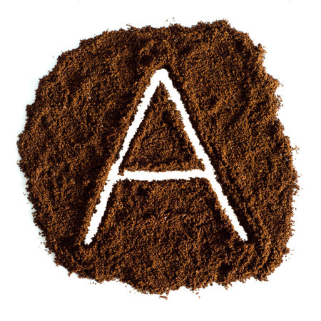 Coffee powder with letter A, isolated on white background.の写真素材