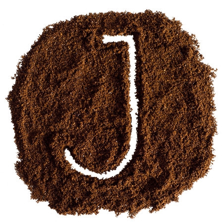 Coffee powder alphabet isolated on white background. Letter J.の写真素材