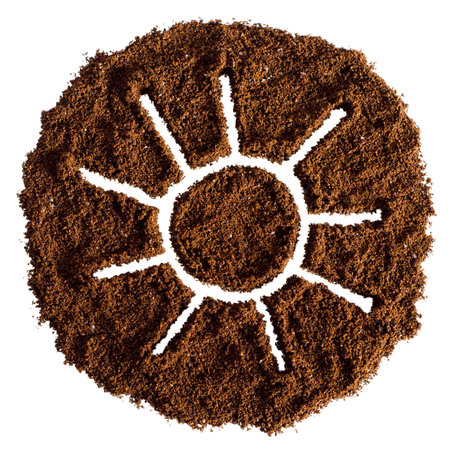 Sun made of ground coffee isolated on white background. top view.の写真素材