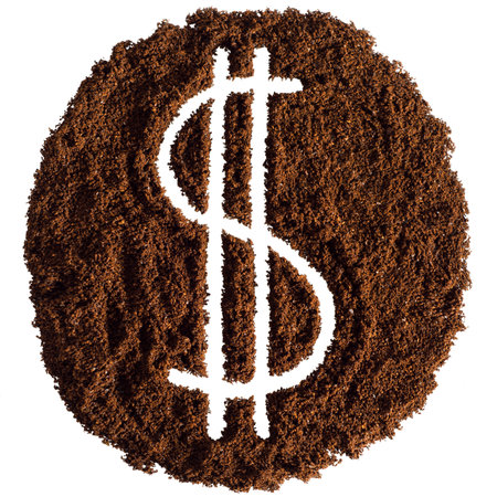 Dollar sign made of ground coffee, isolated on white background.の写真素材