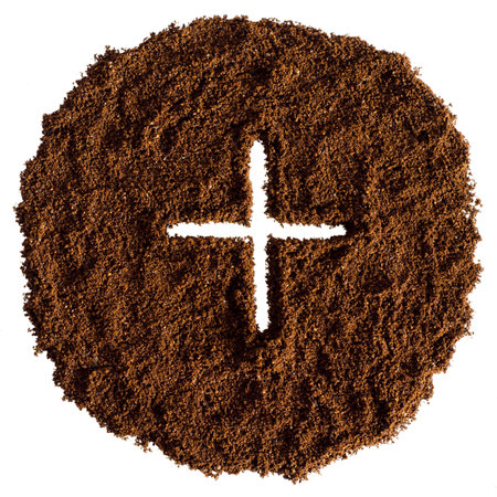 A pile of ground coffee with plus sign isolated on white background.の写真素材