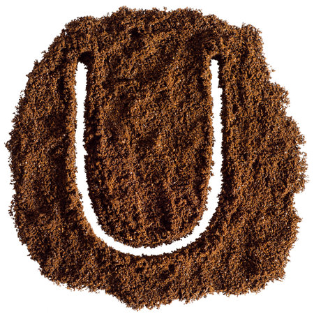 Alphabet made of ground coffee isolated on white background. Letter Uの写真素材