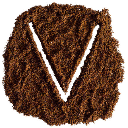 V letter made from ground coffee isolated on white background with clipping pathの写真素材