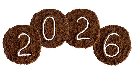 Happy New Year 2026 written with cocoa powder isolated on white background.の写真素材
