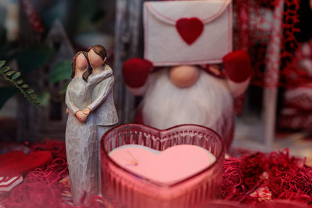 Festive Valentine s Day tabletop display with heart candles, romantic figurines, ceramic lanterns,...