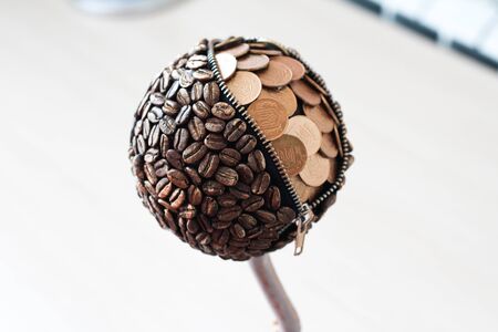 Topiary coffee tree with coins and lockの写真素材