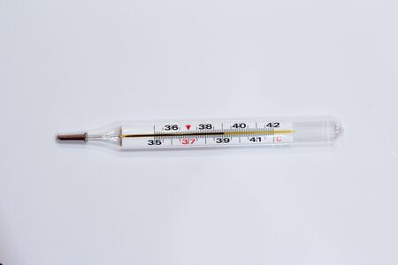 thermometer with temperature 39 on white backgroundの写真素材
