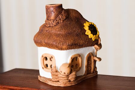 a toy house made of ceramic white-beigeの写真素材