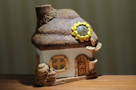 a toy house made of ceramic white-beigeの写真素材