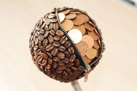 Topiary coffee tree with coins and lockの写真素材