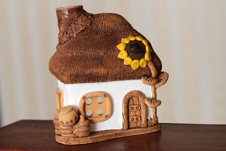 a toy house made of ceramic white-beigeの写真素材