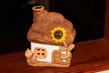 a toy house made of ceramic white-beigeの写真素材