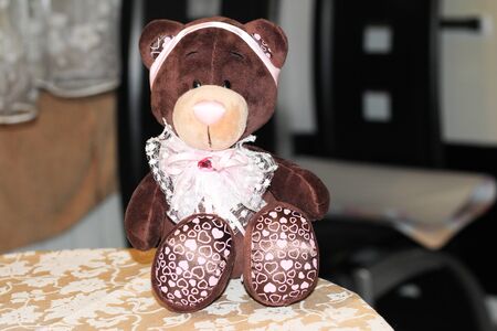 soft toy bear dark brown on a light backgroundの写真素材
