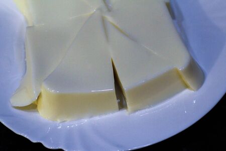 jelly milk dessert on a white plateの写真素材