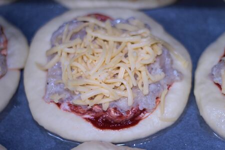 raw homemade pizza with meatの写真素材