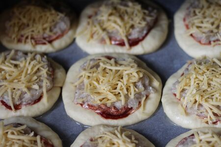 raw homemade pizza with meatの写真素材