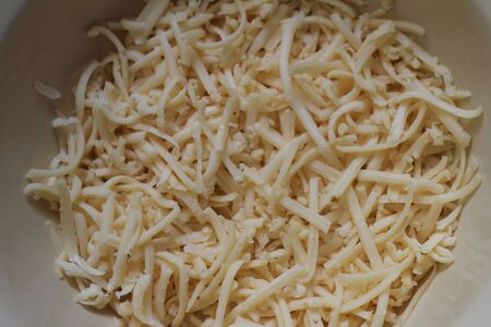grated cheese on a plateの写真素材