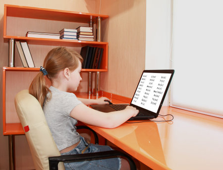 The girl is working on a laptop. Distance learning. Bedroom in the art Nouveau style. Interior of...