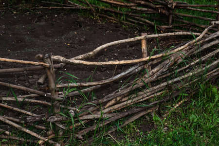 Wicker fence. Decorative fence of branches design of the garden.